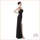 Elegant high slit evening dress in sleek black satin with spaghetti straps
