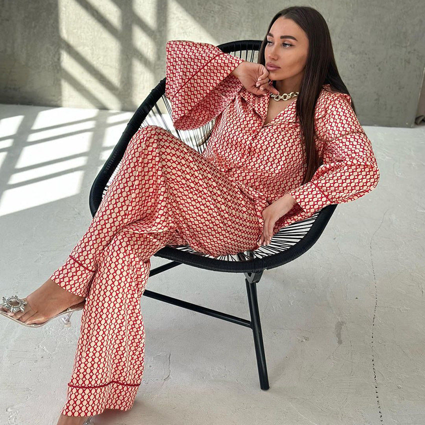 Woman wearing casual comfortable homewear with red and white patterned pajamas and clear heeled sandals