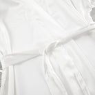 White pleated langry satin dress with elastic waist and scalloped hem