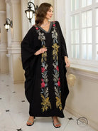 Elegant embroidered Middle East kaftan dress in black floral with gold accents