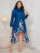 Faux two piece long sleeve dress with blue top and leaf-print skirt