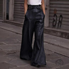 High-waisted faux leather bell bottom pants with belt