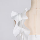 White ruffled dress on mannequin showcasing High Grade Stitching Floral Summer fashion ملابس