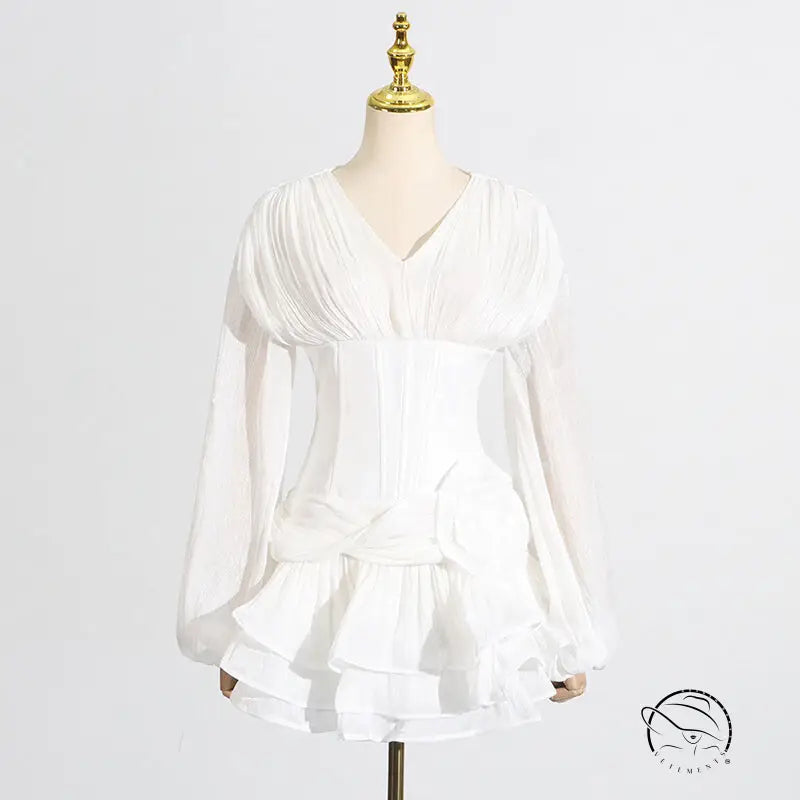 White ruffled langry fashion blouse with long sleeves and pleated bodice