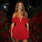 Woman in red off-the-shoulder dress showcasing elegant fashion for ملابس occasions