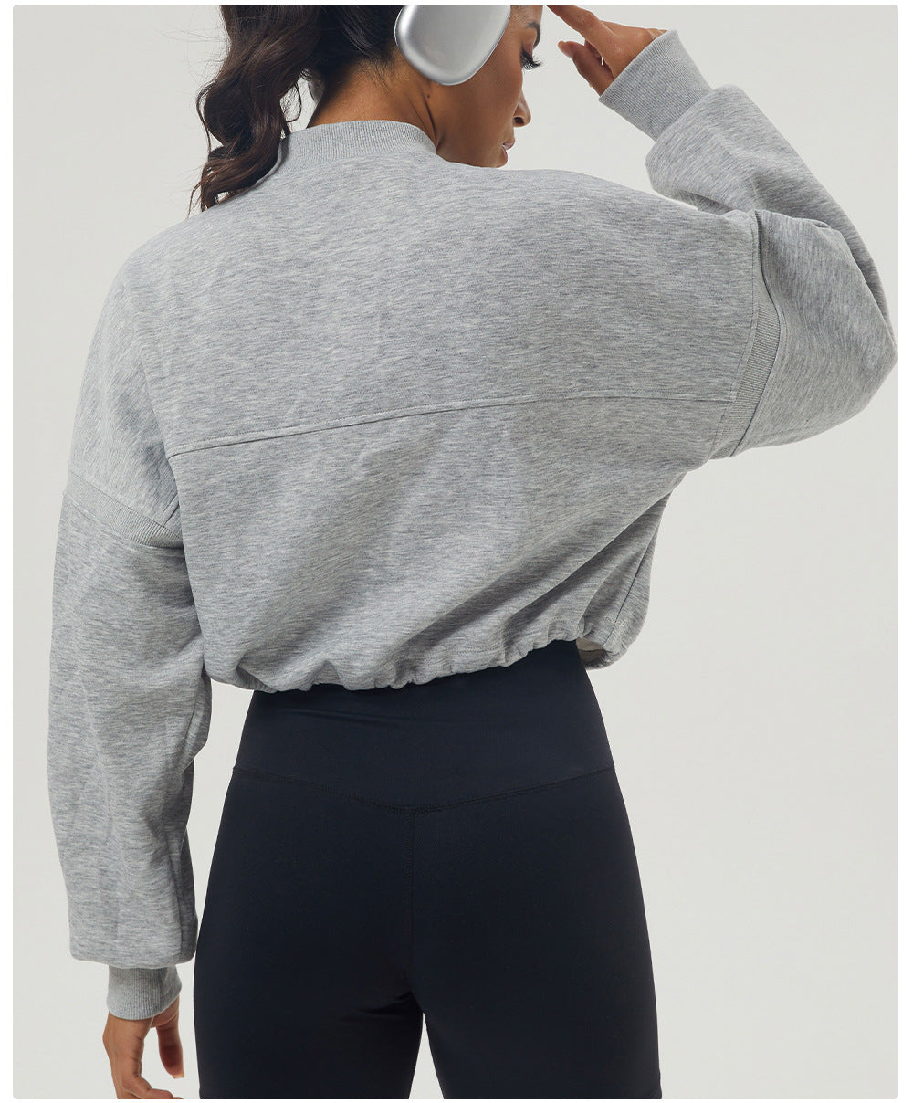 Gray long sleeve cropped sweatshirt with black leggings for autumn winter fashion