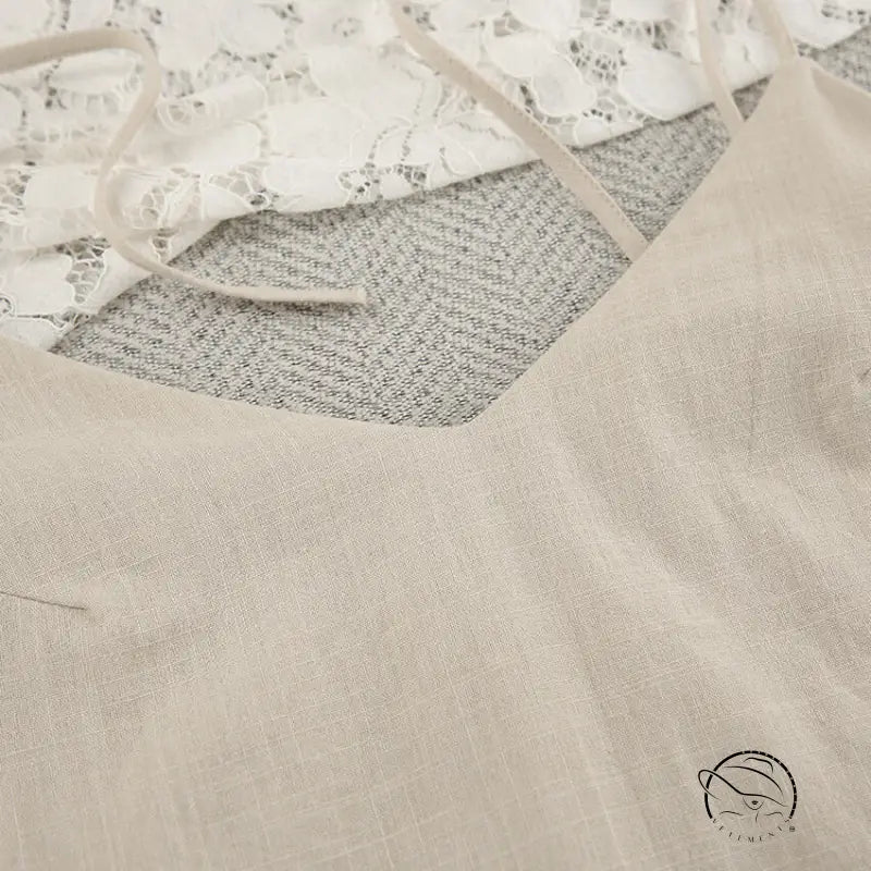 Light-colored backless cotton home wear camisole with thin straps and V-neckline