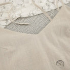 Light-colored backless cotton home wear camisole with thin straps and V-neckline