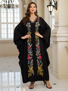Elegant embroidered Middle East abaya dress with black floral gold accents