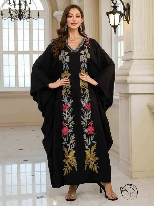 Elegant embroidered Middle East dress: black floral abaya with gold accents, V-neck