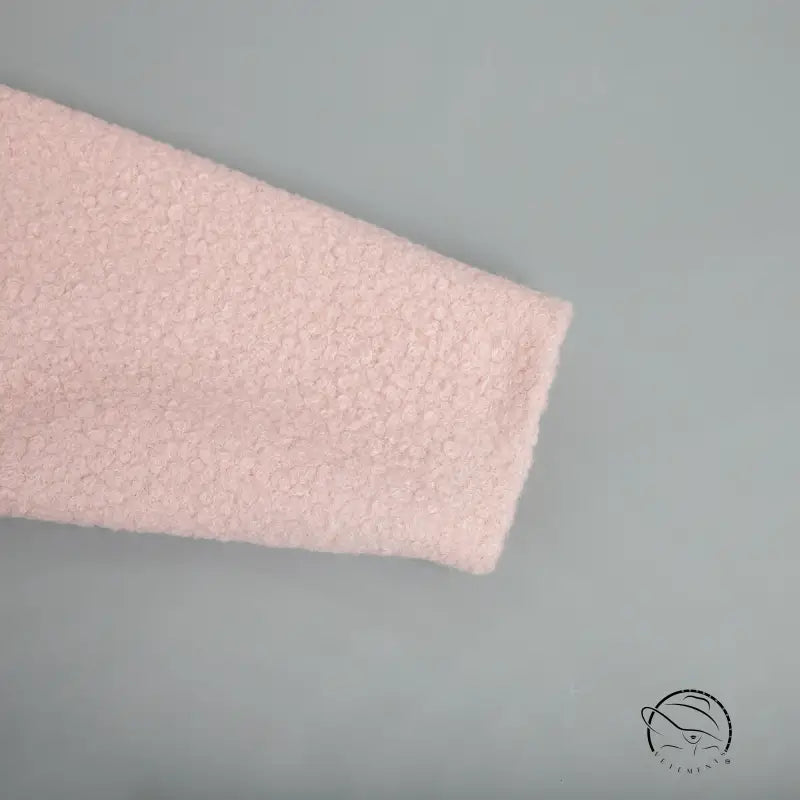 Textured pink fabric in pink short furry coat