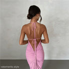 Backless pink halter dress showcasing the elegant slim fit sheath dress design