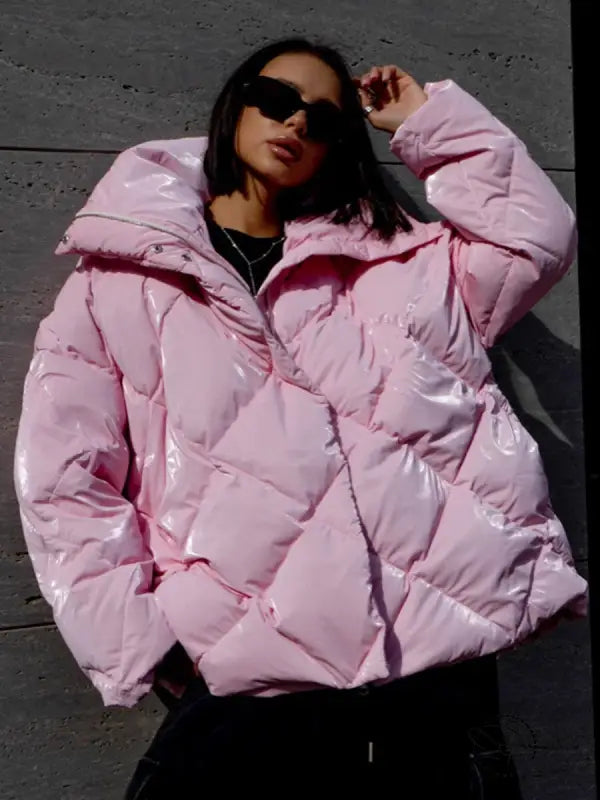 Shiny pink Langry fashion puffer jacket with hood and black sunglasses