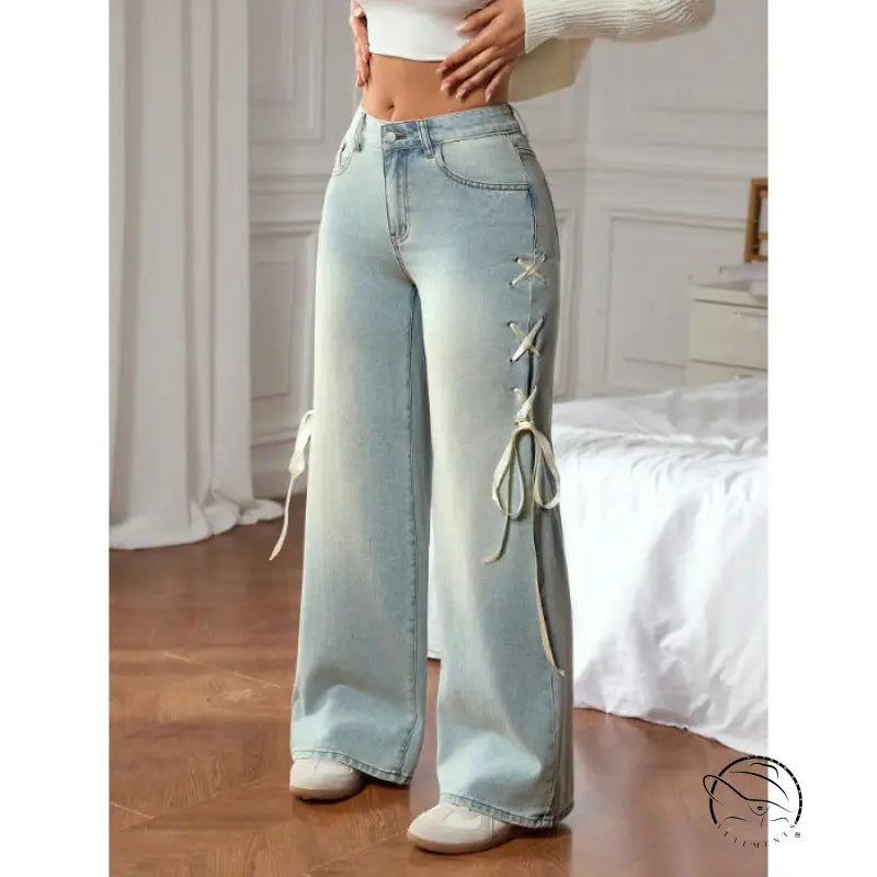 Casual wide leg jeans with light-wash denim and white lace-up detailing