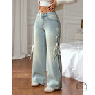 Casual wide leg jeans with light-wash denim and white lace-up detailing