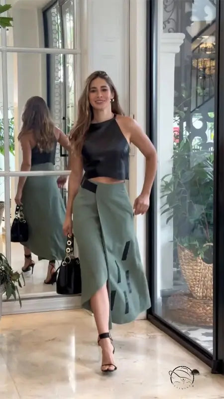 Woman in elegant sleeveless halter short top skirt set