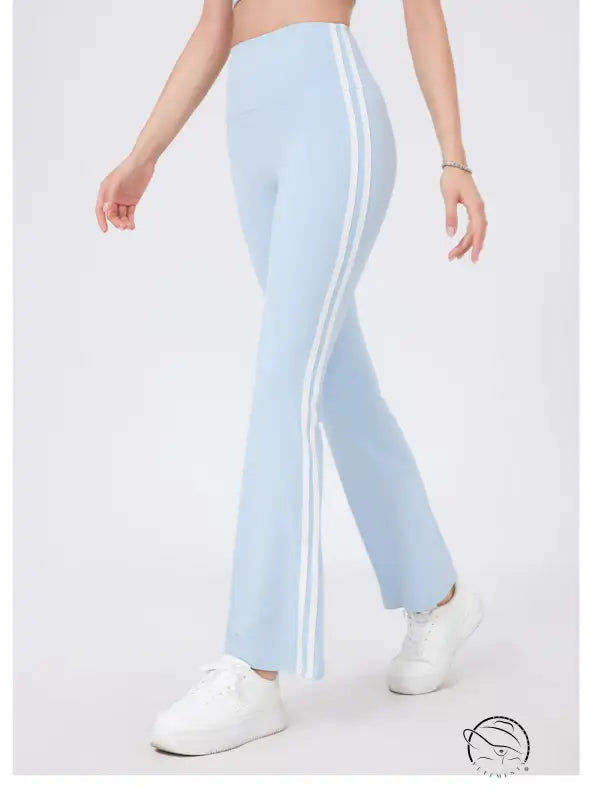 Light blue high waist yoga pants with white stripes and peach hip raise