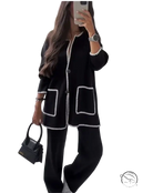 Black knit cardigan with white piped trim, part of women stitching bag set autumn winter