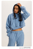 Light blue cropped hoodie and sweatpants loungewear set for cozy winter fashion