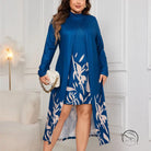 Plus-size woman in faux two piece long sleeve dress with blue abstract leaf pattern