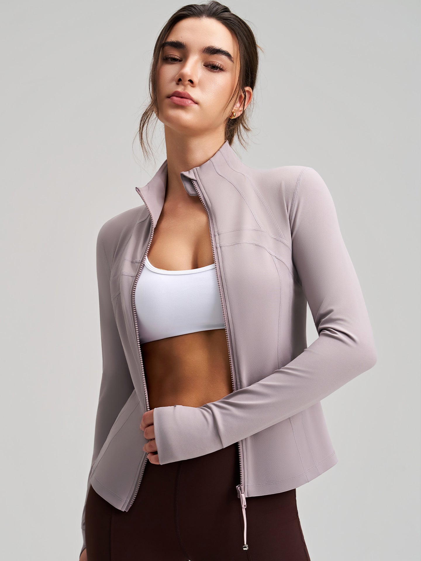 Long sleeve lavender zip-up yoga jacket with drawstring hem and pockets