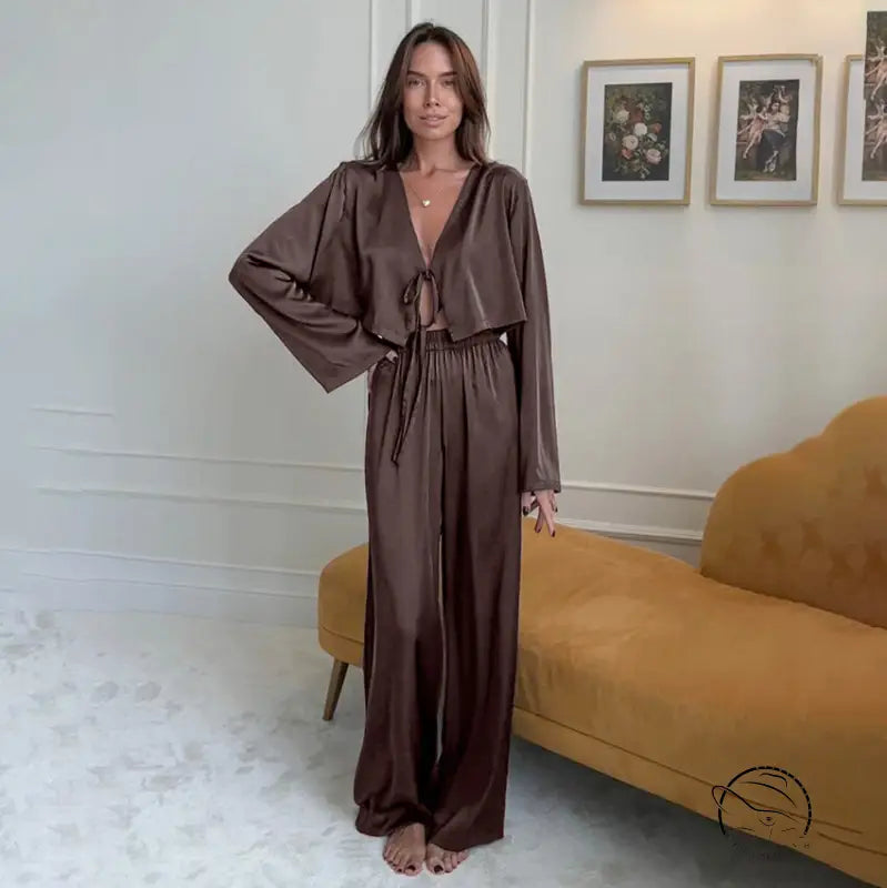 Woman in casual comfortable soft brown satin pajama set homewear