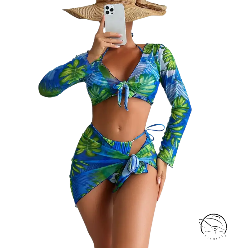 Four piece lace up swimsuit in blue and green tropical leaf print with long sleeves