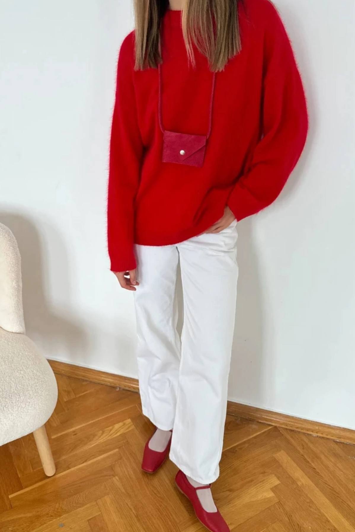 Red wool alpaca oversized sweater with pink accents and pocket detail