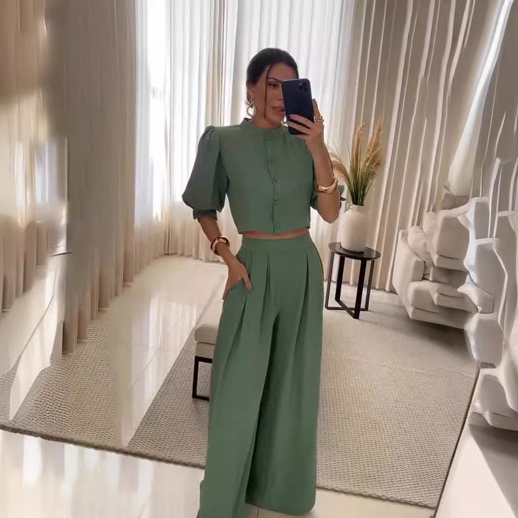 Woman in a green two-piece outfit from Summer Striped Half Sleeve Top Trousers Suit Women Clothing collection, showcasing elegant fashion style