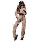 Woman in a beige tracksuit showcasing the Elegant Vetements Suit with long sleeves