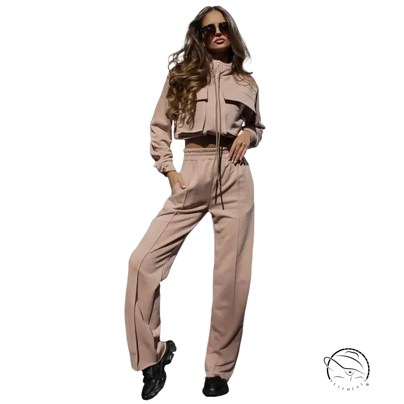 Woman in elegant vetements suit with long sleeve beige tracksuit