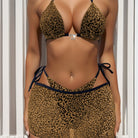 Leopard print bikini with black trim and side ties from the Bikini Double Three Piece Set
