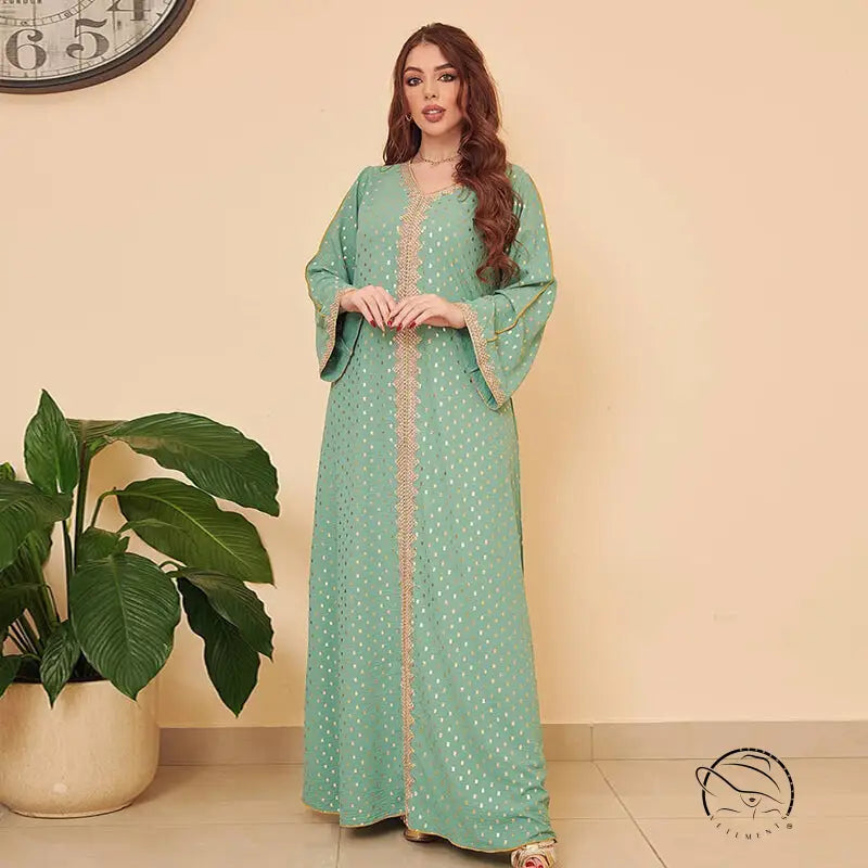 Mint green embroidered kaftan dress with bell sleeves and gold trim in gorgeous Middle East fashion style