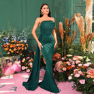 Elegant emerald green strapless mermaid gown showcasing ruched detailing for evening fashion