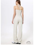 White halter-neck langry fashion jumpsuit with wide-leg quick-drying pants and sneakers