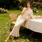 Elegant Langry fashion cream lace summer dress with gold sandals and beige shawl