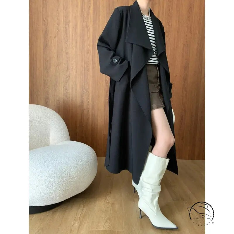 Cozy langry fashion black trench coat with white boots, high-end ملابس