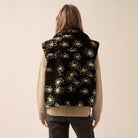 Langry polo collar floral wool coat with black vest and white flowers