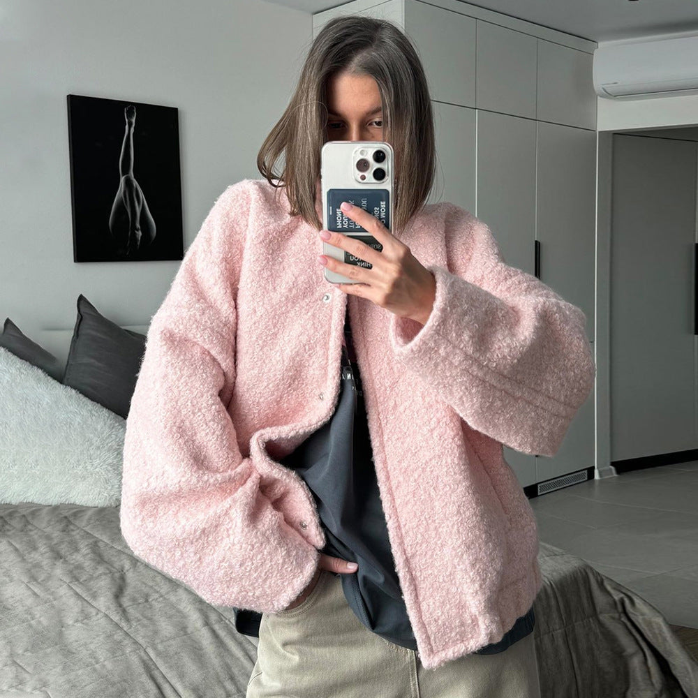 Pink short furry coat displayed with a pink bouclé jacket for fashionable winter wear