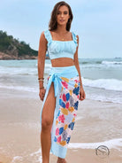 Gorgeous split bikini: light blue crop top and floral sarong with ruched details