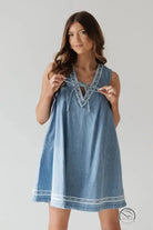 Beautiful embroidered vest denim dress in blue with white trim