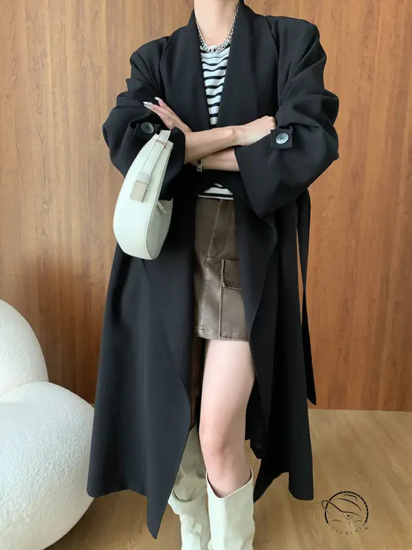 Elegant black trench coat in cozy long high-end fashion style