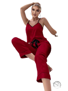 Red satin pajama set with black trim, tie belt, and black eye mask