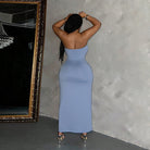 Form-fitting strapless blue maxi dress designed for flattering fashion and elegance