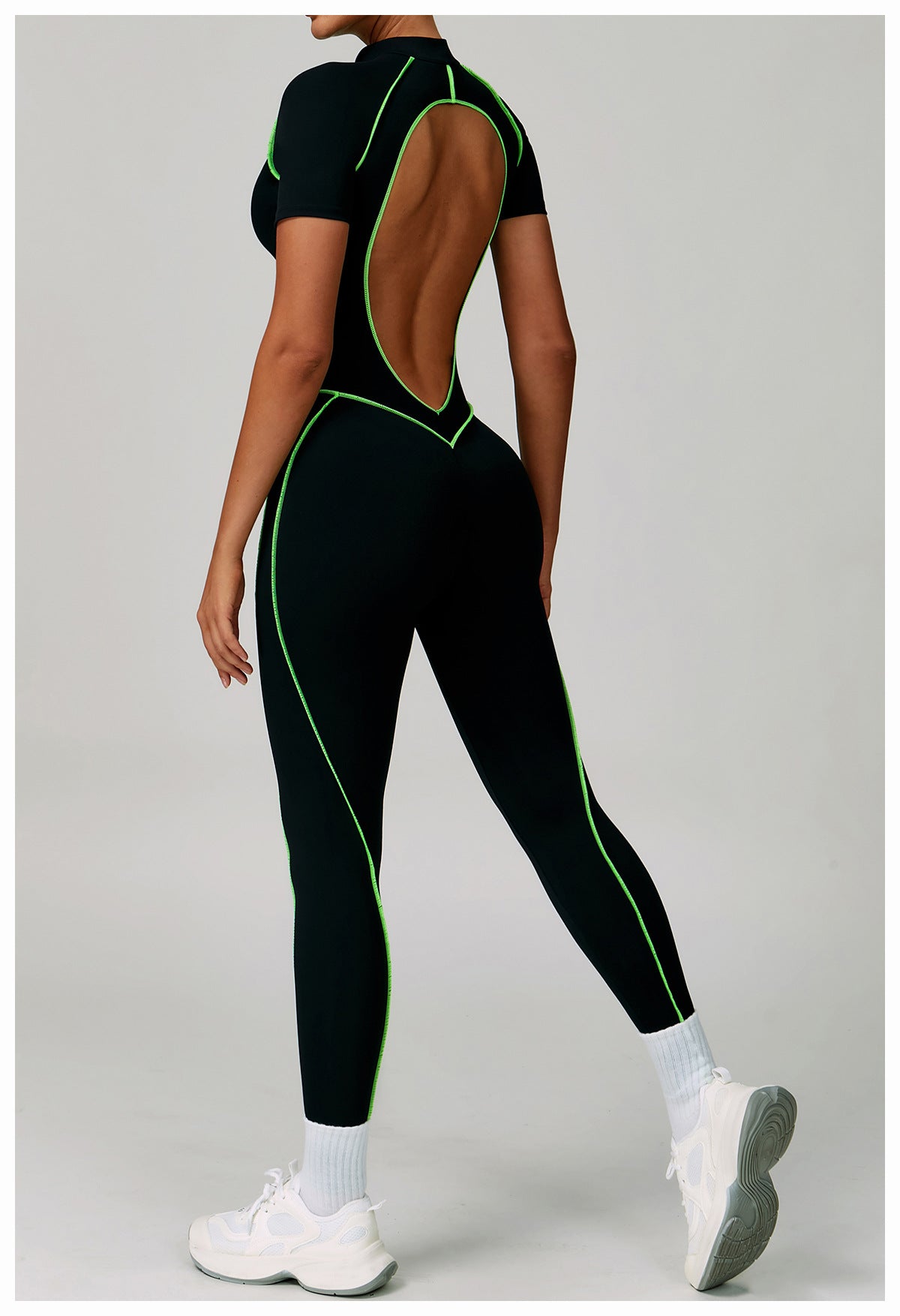 Langry black green open-back fashion jumpsuit with white socks and sneakers for yoga exercise