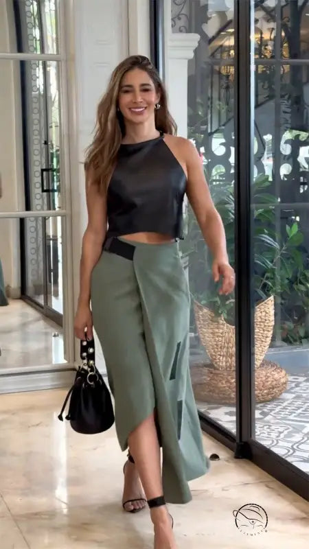 Woman in elegant sleeveless halter short top skirt set