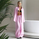 Woman in pink linen pantsuit from Cotton Shirt Trousers Casual Sets showcasing stylish ملابس