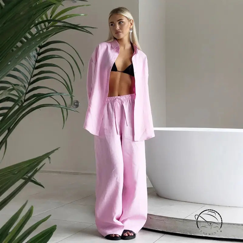 Woman in pink linen pantsuit from Langry cotton shirt fashion set