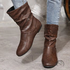 Brown low heel faux leather boots with slouchy wrinkled ankle design