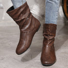 Brown leather ankle boots featuring a slouchy design for low heel faux leather boots